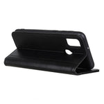 Litchi Skin-autoabsorberende Spaltlæder Telefoncover til Samsung Galaxy A21s