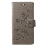 Läderfodral med fjärilsmotiv och blommotiv för Huawei P30 Lite