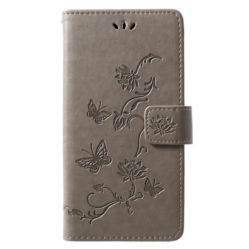 Läderfodral med fjärilsmotiv och blommotiv för Huawei P30 Lite
