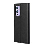 Skyddande läderfodral i litchi-textur till OnePlus 9 Pro med plånboksställ