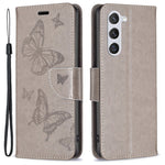 Samsung Galaxy S23 Plånboksfodral Läderfodral med Tryckta Fjärilar och Rem