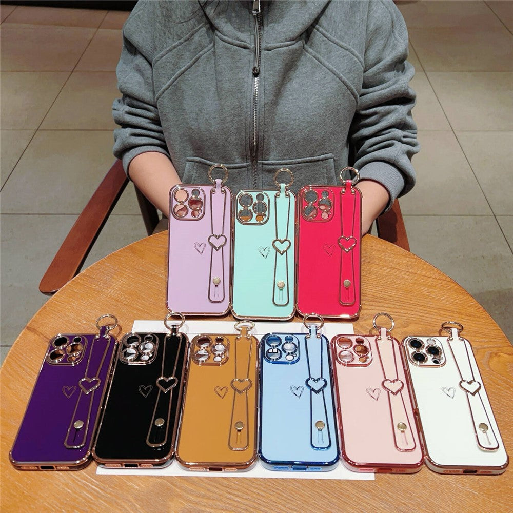 For iPhone 16 Pro Case Electroplated Heart Pattern TPU Phone Back Cover with Wristband Kickstand