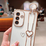 Til Samsung Galaxy A36 5G / A56 5G etui elektrobelagt hjerte mønster TPU telefonbagcover med håndledsrem/stativ