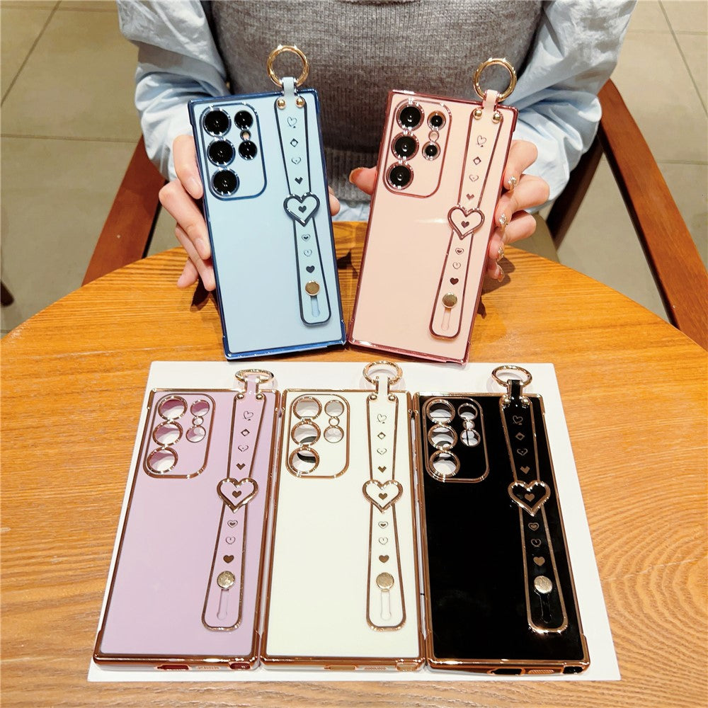 Samsung Galaxy S24 Ultra-cover med hjerte, håndledsrem og stativ, elektropletteret TPU-mobilcover